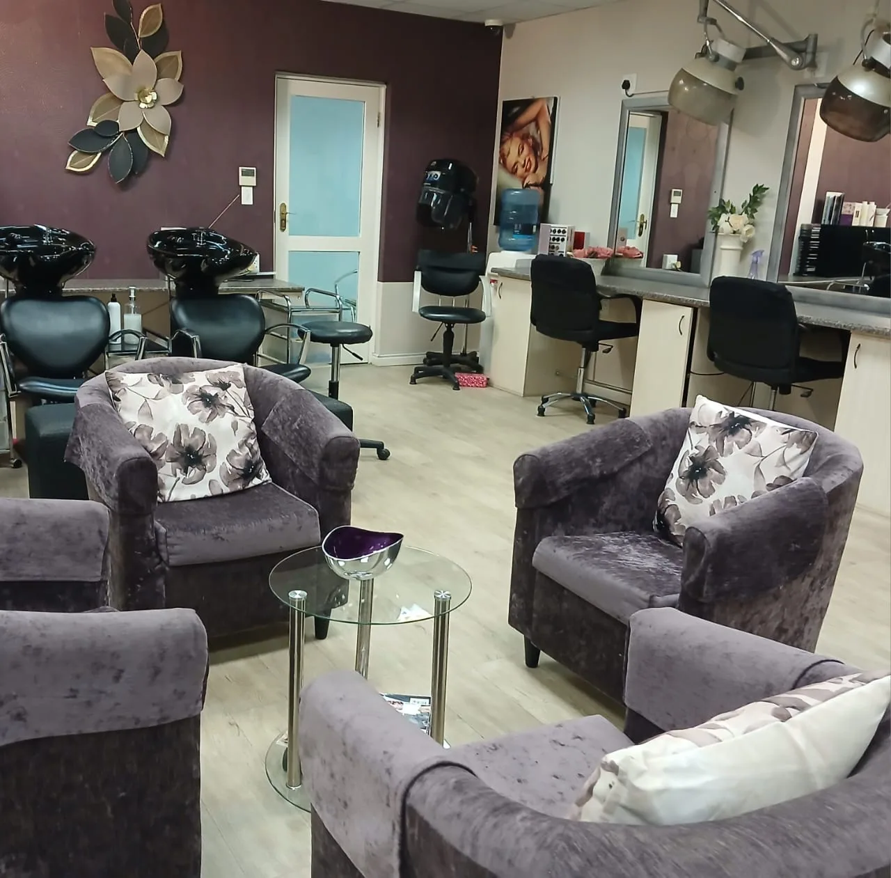 Inside Taurelle, with comfortable purple chairs, hair washing basins and styling stations