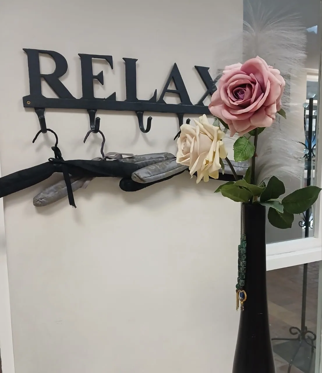 The Relax coat hooks and pink and cream roses at Taurelle