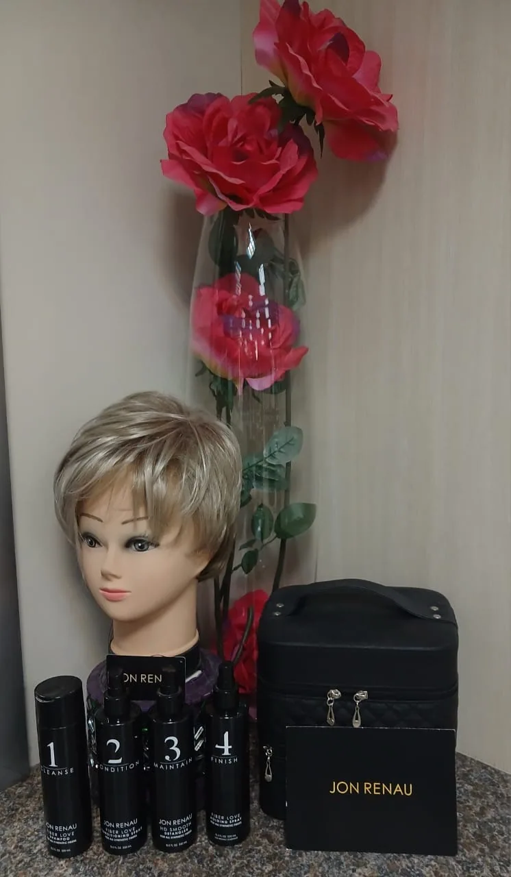 A short blonde wig with Jon Renau hair care products at Taurelle